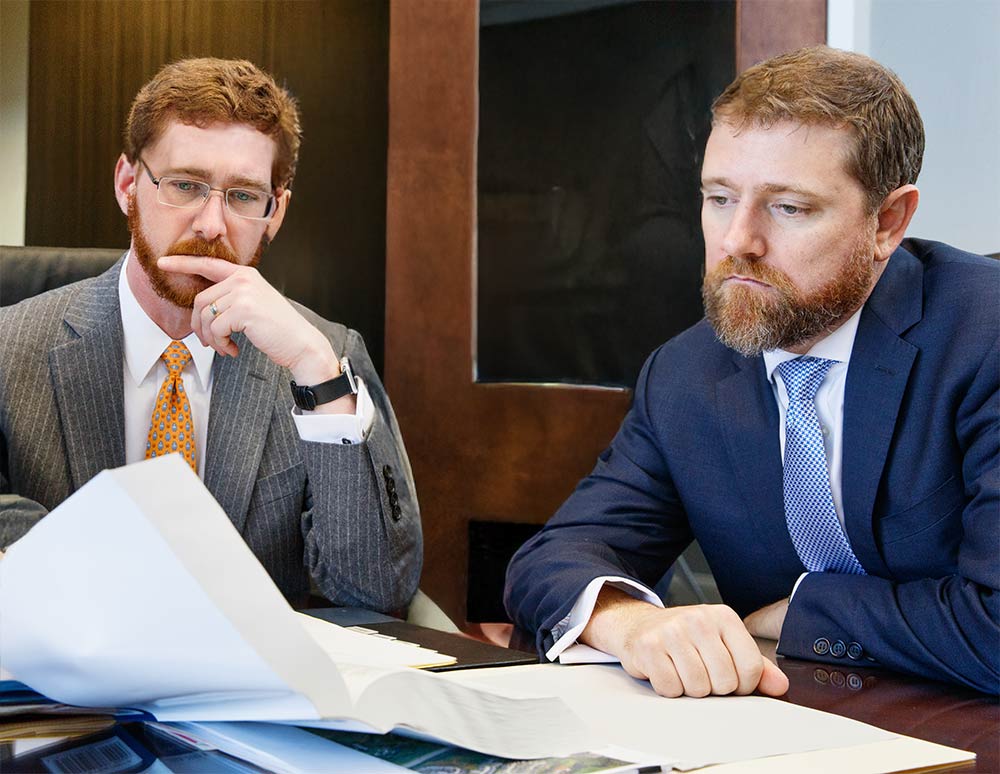 Joshua Hedrick and Cullen Wojcik collaborate in their conference room in downtown Knoxville | Knox Defense | Knoxville Criminal Defense Lawyers