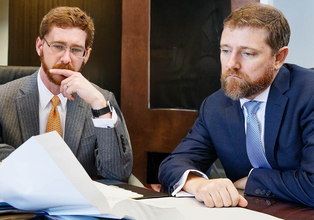 Joshua Hedrick and Cullen Wojcik collaborate in their conference room in downtown Knoxville | Knox Defense | Knoxville Criminal Defense Lawyers Joshua Hedrick and Cullen Wojcik collaborate in their conference room in downtown Knoxville | Knox Defense | Knoxville Criminal Defense Lawyers